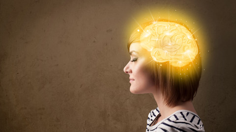 Girl with a glowing brain and grey background